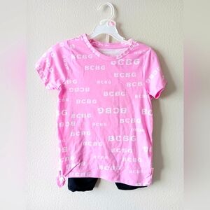 BCBGirls pink short sleeve t-shirt with tie  and black/pink shorts. / Size: 10